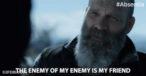 A Man With A Beard Says " The Enemy Of My Enemy Is My Friend " In A Video GIF