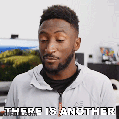 A Man With A Beard Says There Is Another While Wearing A White Jacket GIF