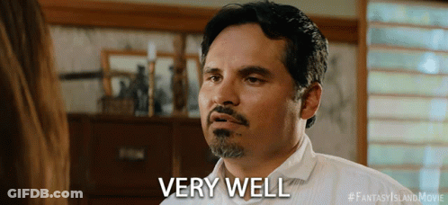 A Man With A Beard Says Very Well In Front Of A Woman GIF