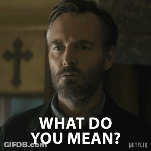 A Man With A Beard Says " What Do You Mean " In Front Of A Cross GIF