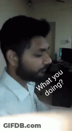 A Man With A Beard Says " What You Doing " GIF