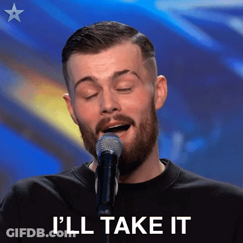 A Man With A Beard Singing Into A Microphone With The Words I 'Ll Take It Below Him GIF