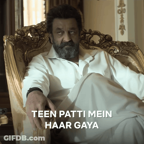 A Man With A Beard Sits In A Chair With The Words Teen Patti Mein Haar Gaya Written Below Him GIF