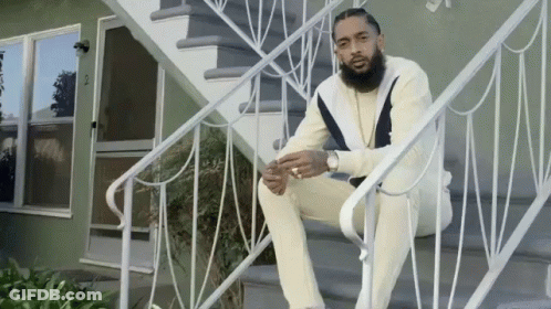 Man Sitting On White Stairs GIF