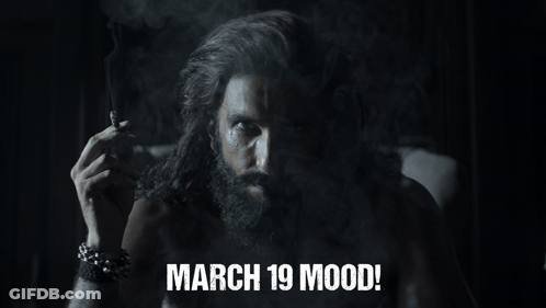 A Man With A Beard Smoking A Cigarette With The Words March 19 Mood GIF