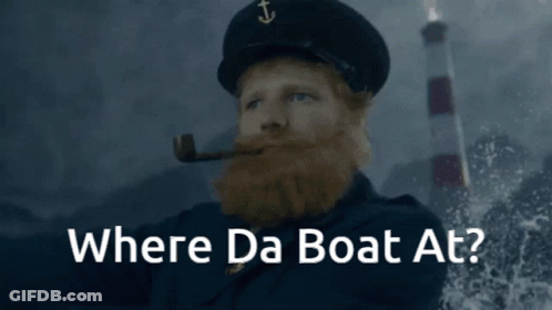 A Man With A Beard Smoking A Pipe With The Words Where Da Boat At GIF