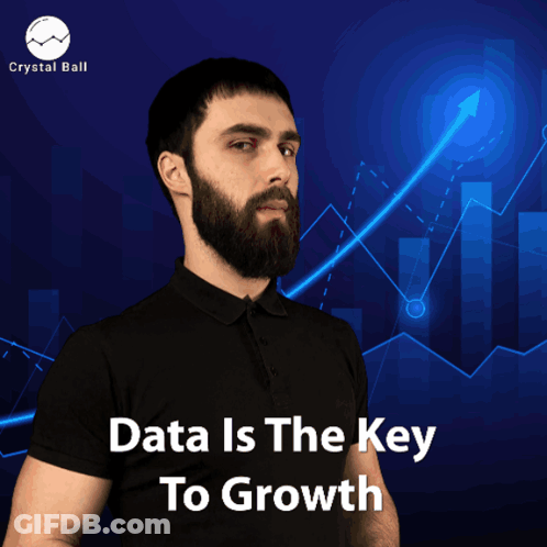 A Man With A Beard Stands In Front Of A Graph With The Words Data Is The Key To Growth GIF