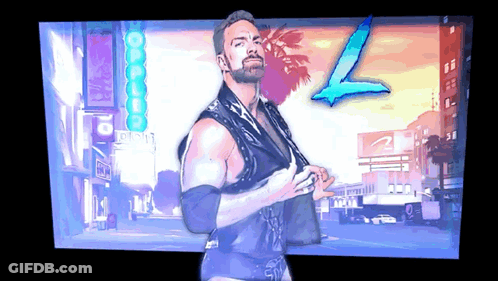 A Man With A Beard Stands In Front Of A Sign That Says L GIF