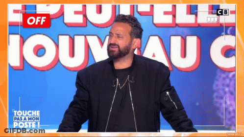 A Man With A Beard Stands In Front Of A Sign That Says " Off " GIF