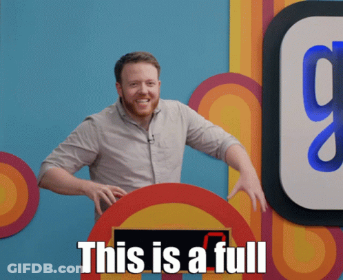 A Man With A Beard Stands In Front Of A Sign That Says " This Is A Full " GIF