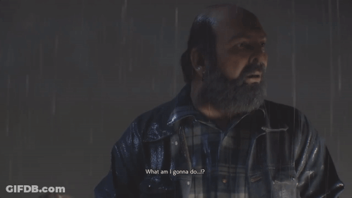 A Man With A Beard Stands In The Rain Next To A Woman GIF
