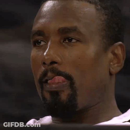 A Man With A Beard Sticks His Tongue Out GIF