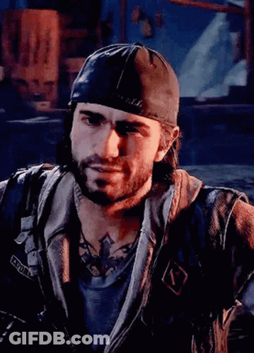 A Man With A Beard Wearing A Baseball Cap And A Leather Jacket Is Looking At The Camera . GIF