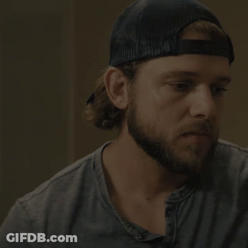 A Man With A Beard Wearing A Baseball Cap Says I 'Ll Be Back Soon GIF