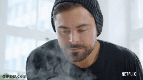 A Man With A Beard Wearing A Beanie And A Black Shirt With Netflix Written On The Bottom GIF