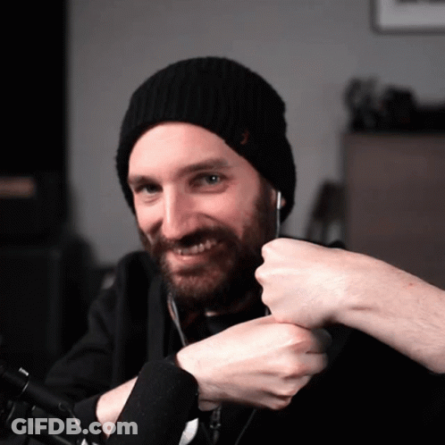 A Man With A Beard Wearing A Black Beanie GIF