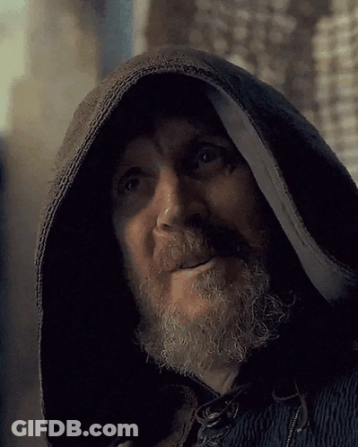 A Man With A Beard Wearing A Black Hooded Jacket GIF
