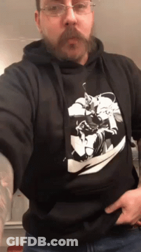 A Man With A Beard Wearing A Black Hoodie GIF