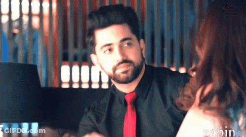 A Man With A Beard Wearing A Black Shirt And Red Tie GIF