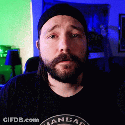 A Man With A Beard Wearing A Black Shirt That Says ' Angar ' GIF