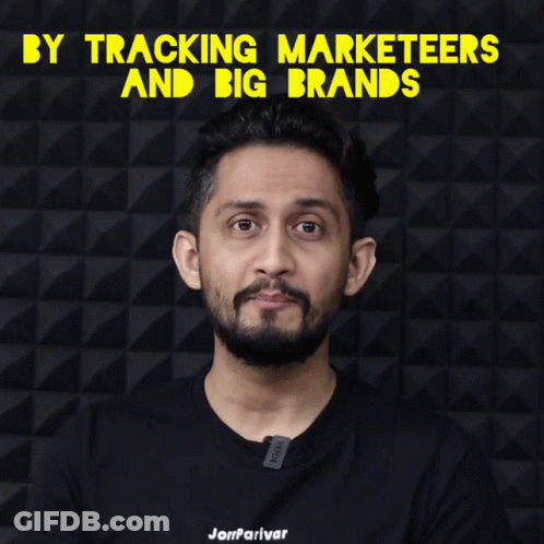 A Man With A Beard Wearing A Black Shirt That Says ' Jamparivar ' On It GIF