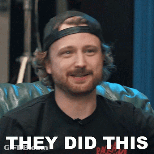 A Man With A Beard Wearing A Black Shirt That Says They Did This On It GIF