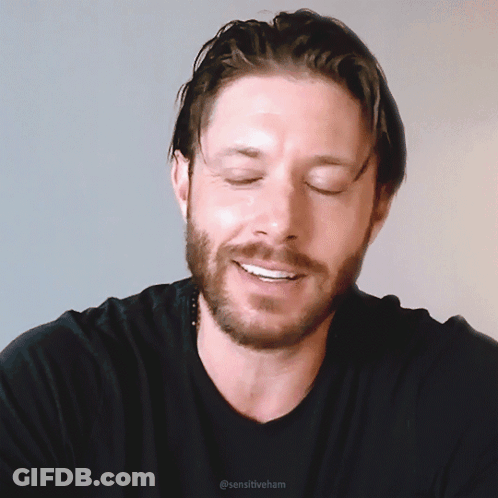 A Man With A Beard Wearing A Black Shirt With Sensitiveham Written On The Bottom GIF