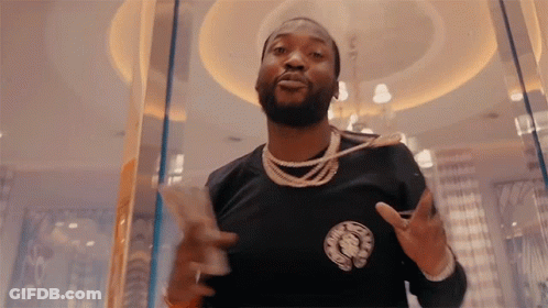 A Man With A Beard Wearing A Black Shirt With The Word Chrome Hearts On The Front GIF