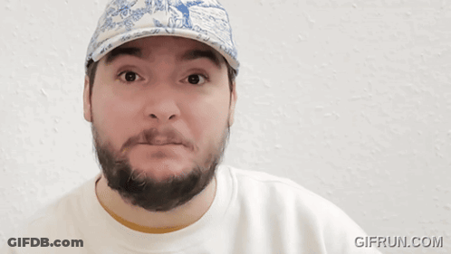 A Man With A Beard Wearing A Blue And White Hat With The Words This Boy 'S In Denial GIF