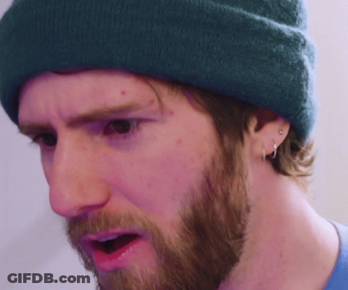A Man With A Beard Wearing A Blue Beanie GIF