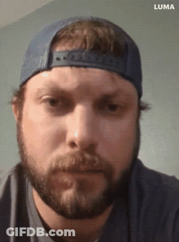 A Man With A Beard Wearing A Blue Hat And A Luma Logo On The Bottom GIF