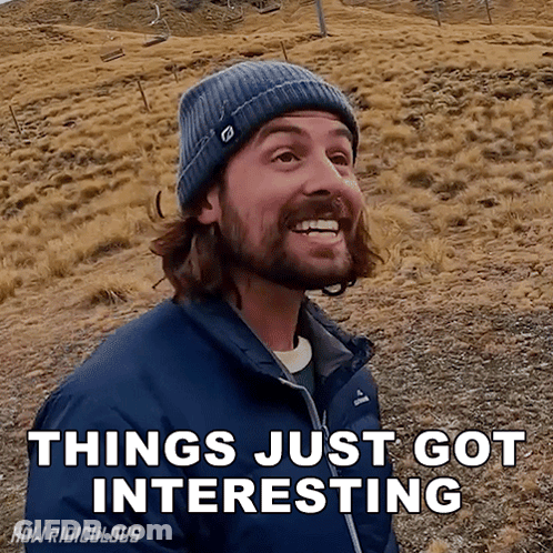 A Man With A Beard Wearing A Blue Jacket And A Beanie Says " Things Just Got Interesting " GIF