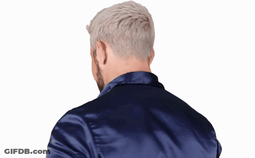 A Man With A Beard Wearing A Blue Jacket GIF