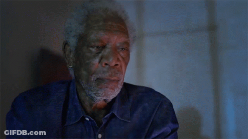 A Man With A Beard Wearing A Blue Shirt GIF