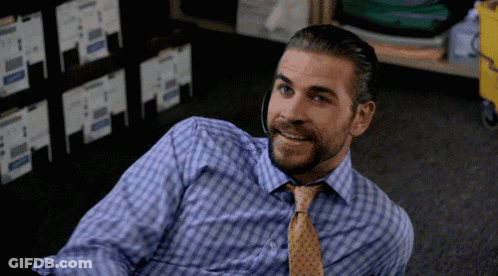 A Man With A Beard Wearing A Blue Shirt And Tie GIF