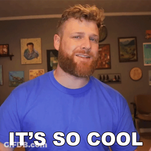 A Man With A Beard Wearing A Blue Shirt Says It 'S So Cool GIF