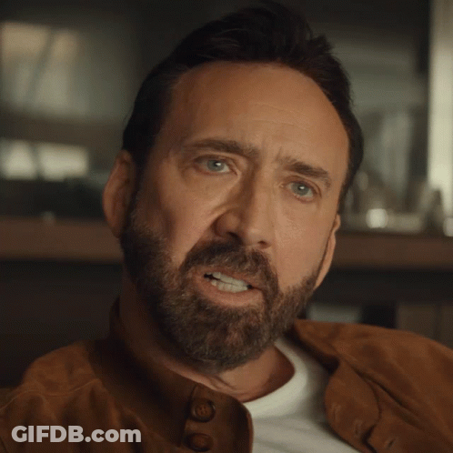 A Man With A Beard Wearing A Brown Leather Jacket GIF