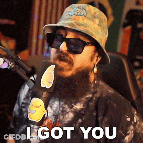 A Man With A Beard Wearing A Bucket Hat And Sunglasses Says I Got You GIF