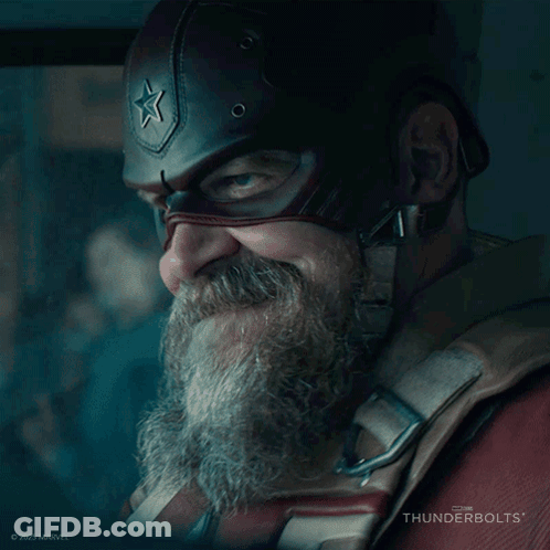 A Man With A Beard Wearing A Captain America Helmet With A Star On It GIF