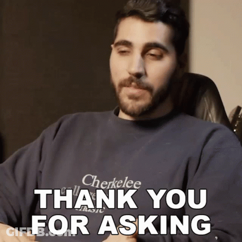 A Man With A Beard Wearing A Cherkelee Shirt Says " Thank You For Asking " GIF