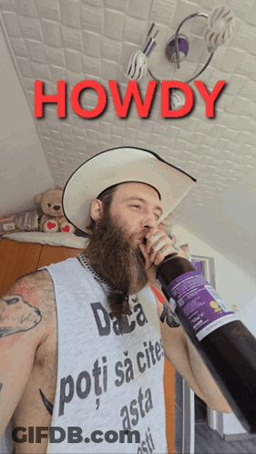 A Man With A Beard Wearing A Cowboy Hat Is Drinking From A Bottle With The Words Howdy Above Him GIF