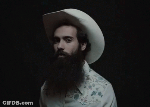 A Man With A Beard Wearing A Cowboy Hat GIF