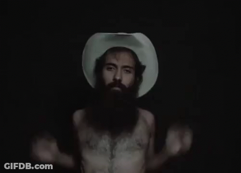 A Man With A Beard Wearing A Cowboy Hat GIF