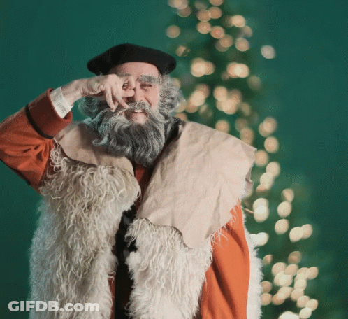 A Man With A Beard Wearing A Fur Vest And A Black Hat GIF