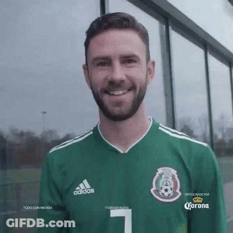 A Man With A Beard Wearing A Green Adidas Jersey GIF