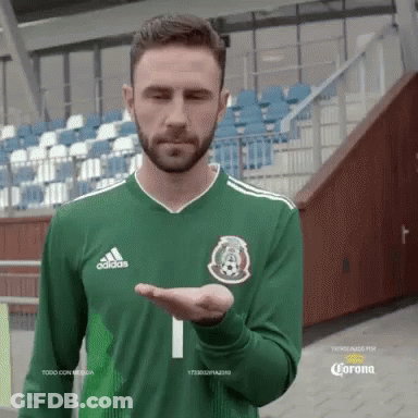 A Man With A Beard Wearing A Green Adidas Shirt GIF
