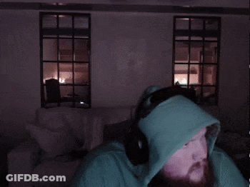 A Man With A Beard Wearing A Green Hoodie GIF