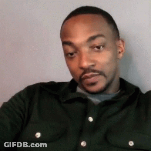 A Man With A Beard Wearing A Green Shirt GIF