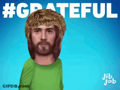 A Man With A Beard Wearing A Green Shirt With The Words #Grateful Above Him GIF