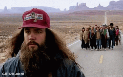 A Man With A Beard Wearing A Gump Hat GIF